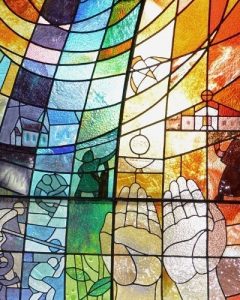The beautiful stained-glass window, now in the Sacred Heart School library. 